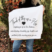A gift of gratitude and hugs on a cozy fleece blanket for friends.