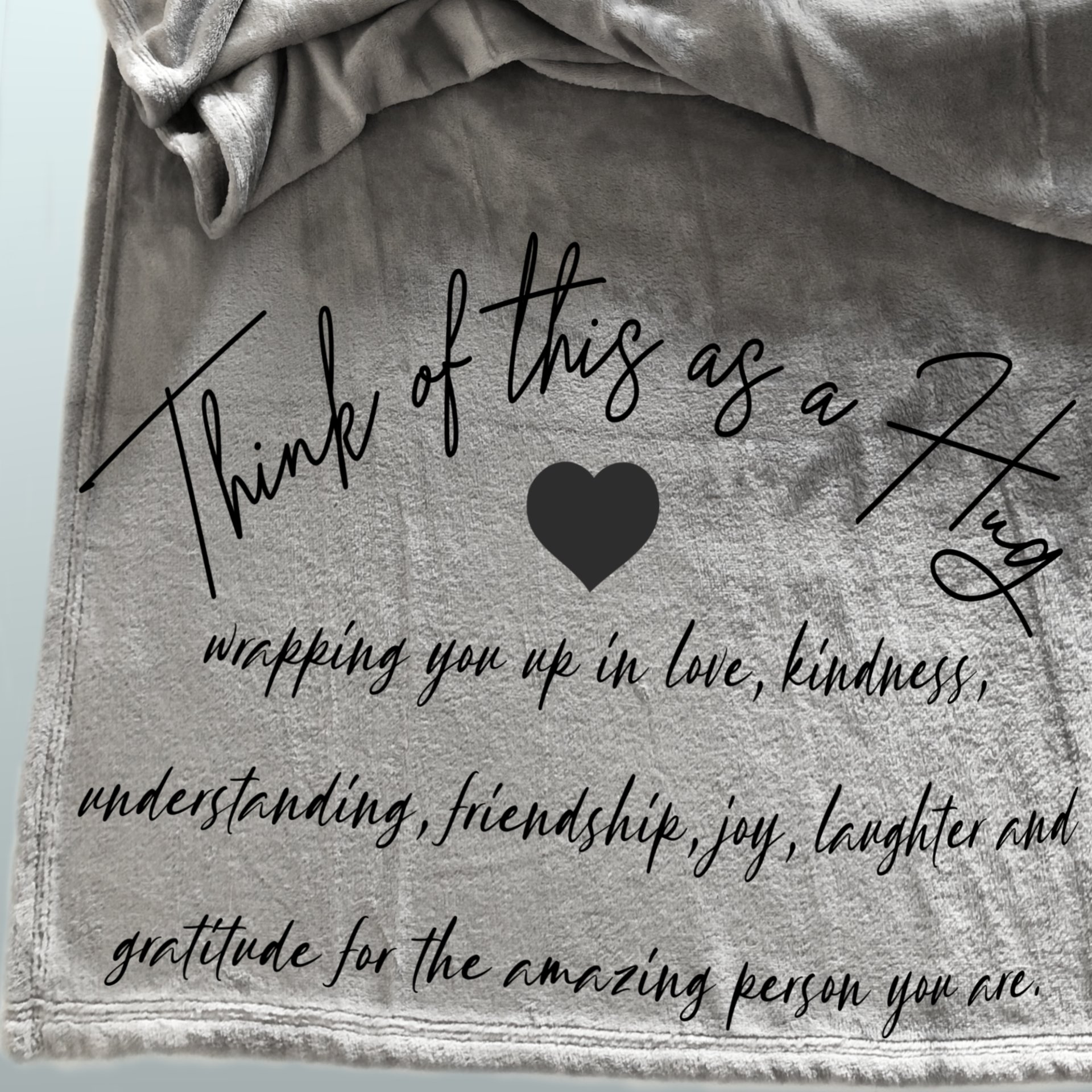 A gift of gratitude and hugs on a cozy fleece blanket for friends.