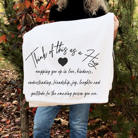 A gift of gratitude and hugs on a cozy fleece blanket for friends.